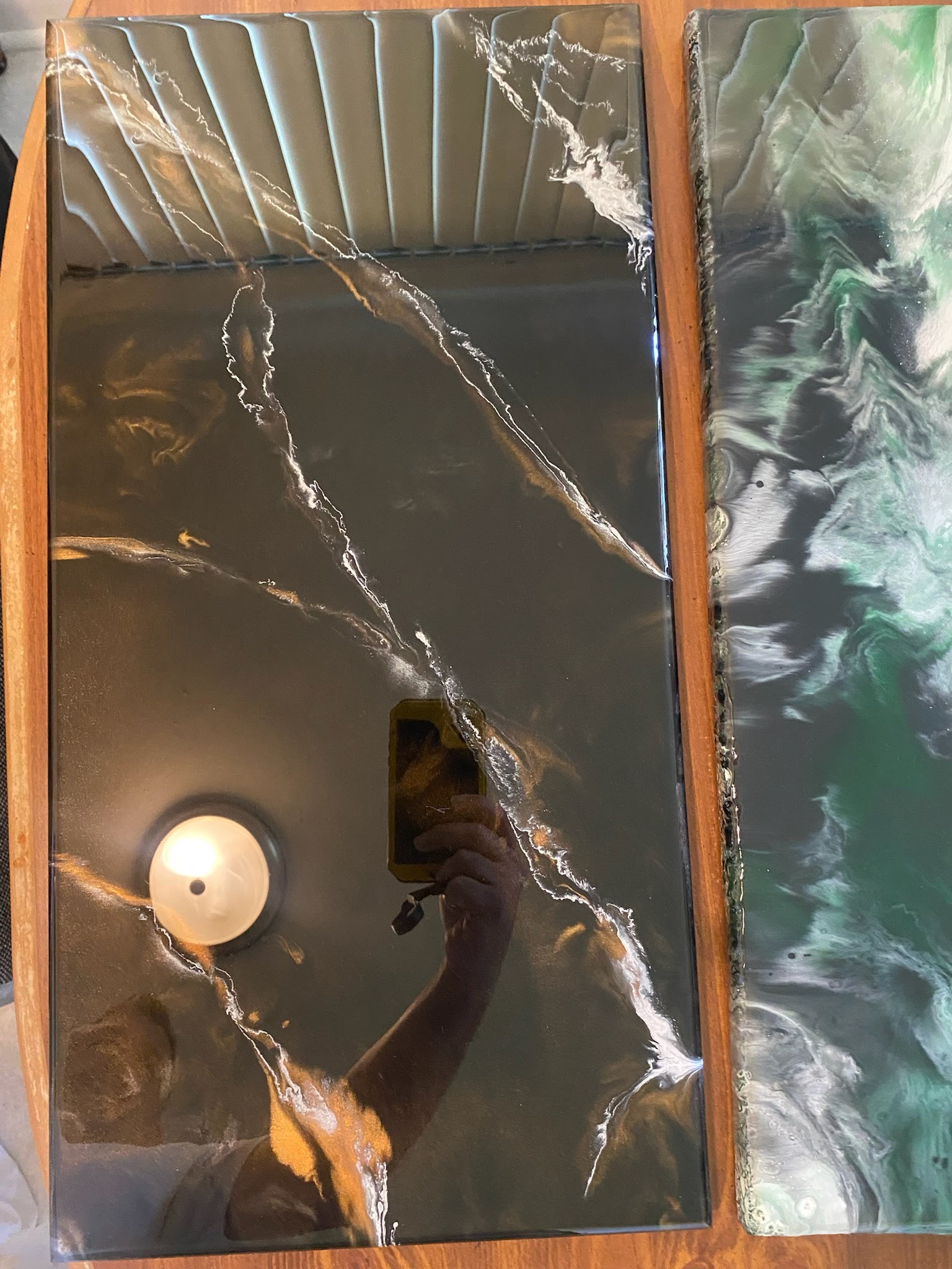 Two custom resin panels — dark with gold streaks and green and white marble