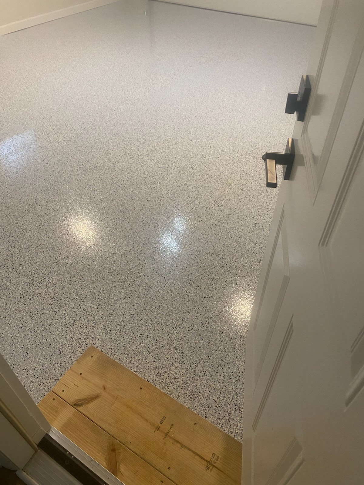 Custom floor finish in white and gray speckle