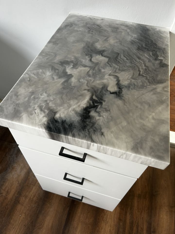 White cabinet with custom gray-and-black marbled resin top